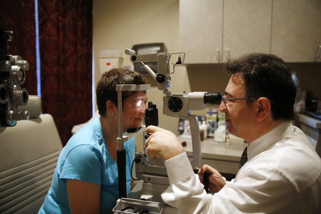 Dr. Abrams examining his patient after PRK (Photorefractive keratectomy) surgery